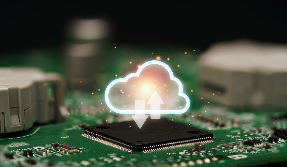 Cloud computing concept showing glowing cloud icon over electronic circuit board, symbolizing FinOps and GreenOps in sustainable IT