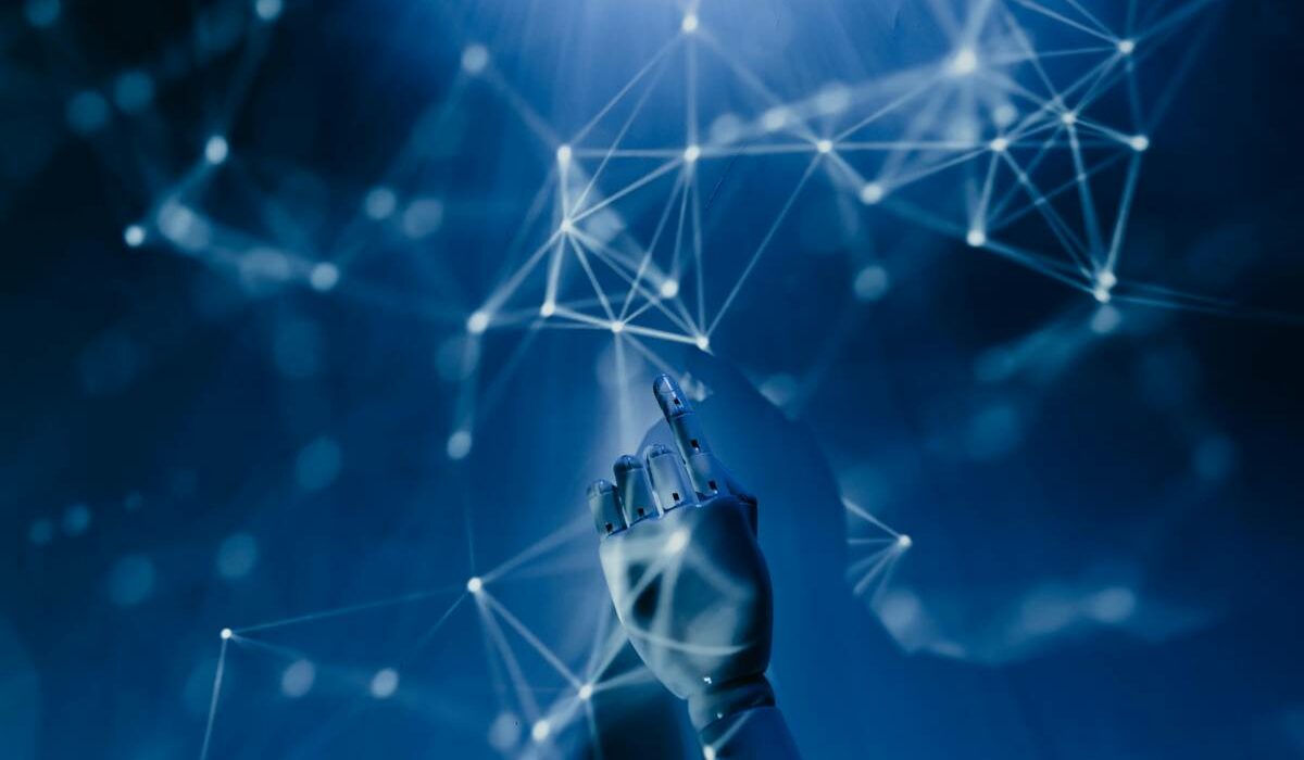 Artificial intelligence concept showing robotic hand interacting with a digital network symbolizing Data Mesh and Data Fabric architectures for modern data management